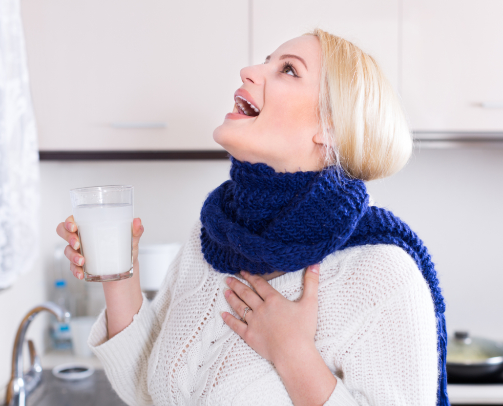 An image of a woman gargling with salt water