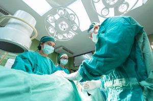 An image of surgical staff operating on a patient