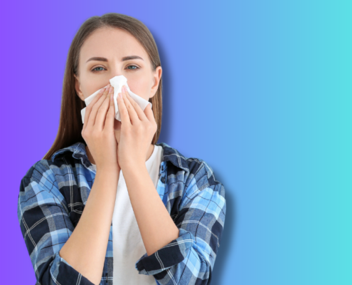 An image of a woman with a viral respiratory infection blowing her nose.