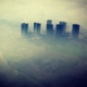 An image of thick smog air pollution obscuring city buildings